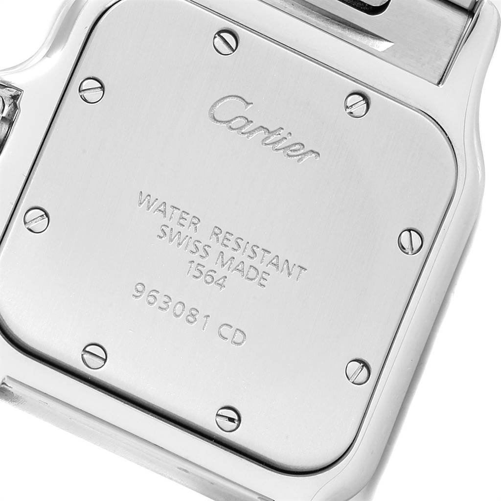 This image shows the case back of a Cartier Santos W20060D6 Stainless Steel Silver Dial W20060D6 Stainless Steel Silver Dial watch, highlighting its engraved details and screws.