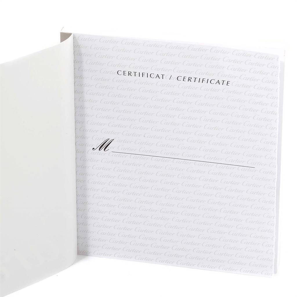 The image shows a certificate booklet for the Santos model by Cartier, with the booklet partially open.