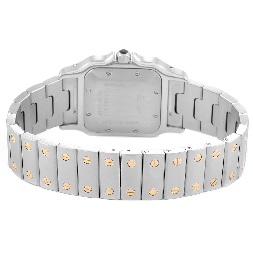 This image shows the back side of a Santos model watch by Cartier, highlighting the case back and bracelet.