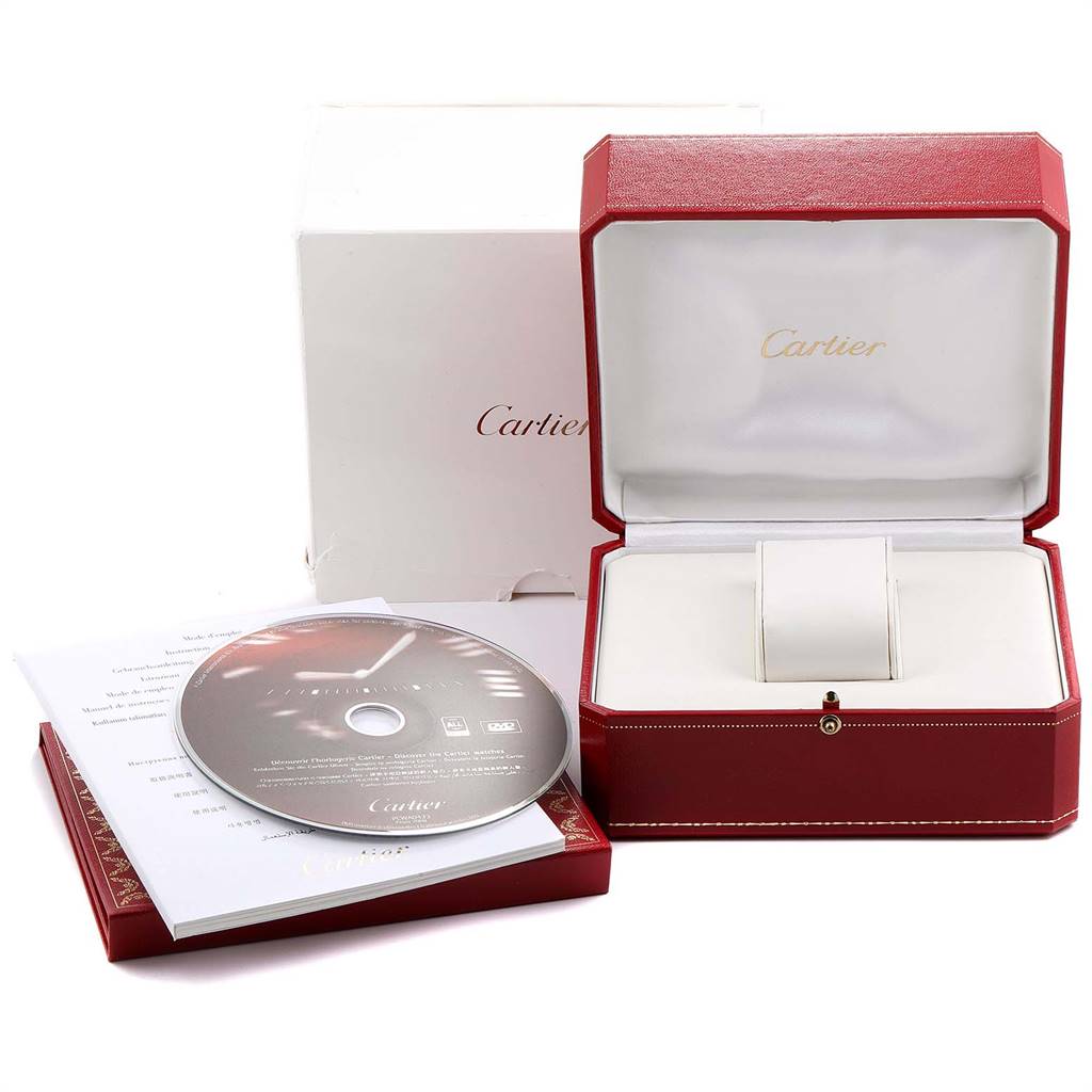 The image shows the packaging and accessories of a Cartier Santos W20044D6 Women's Stainless Steel Silver Dial W20044D6 Women's Stainless Steel Silver Dial watch, including a box, booklet, and DVD.
