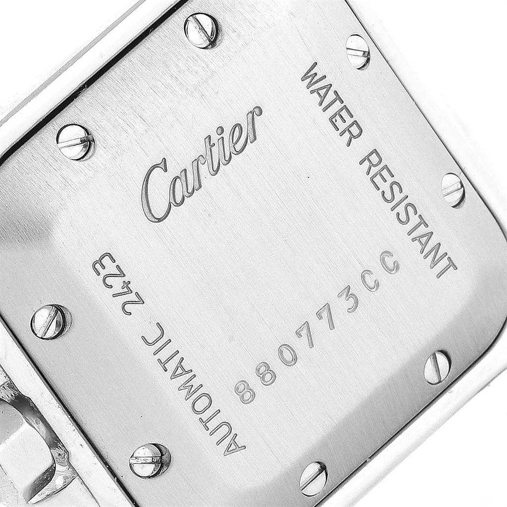This image shows the back case of a Cartier Santos W20057C4 Women's Stainless Steel Silver Dial W20057C4 Women's Stainless Steel Silver Dial watch, including inscriptions and screws.