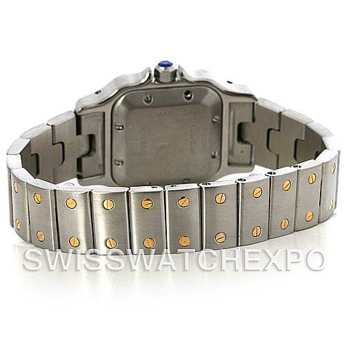 The image shows the back view of a Santos model by Cartier, focusing on the watch's case back and bracelet with two-tone links.