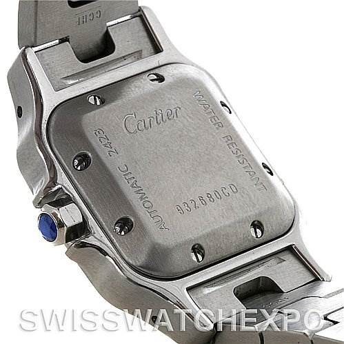 The image shows the back case of a Cartier Santos Women's Stainless Steel Silver Dial Women's Stainless Steel Silver Dial watch at an oblique angle, highlighting the engraved details and the clasp.