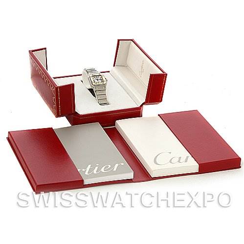 This image shows a Cartier Santos Women's Stainless Steel Silver Dial Women's Stainless Steel Silver Dial watch at an angle with its open box and accompanying booklets.