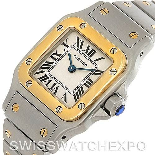 The image shows a close-up angled view of the Cartier Santos W20012C4 Women
s Stainless Steel Silver Dial W20012C4 Women
s Stainless Steel Silver Dial watch, highlighting its face, bezel, crown, and part of the bracelet.