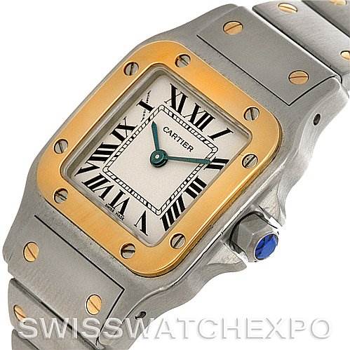 This image shows a Santos model by Cartier, viewed from an angled top perspective, displaying its face, bezel, and part of the bracelet.