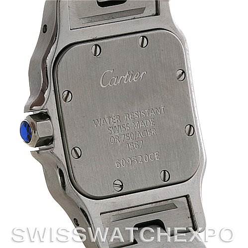 The image shows the back case and part of the band of a Cartier Santos W20012C4 Women
s Stainless Steel Silver Dial W20012C4 Women
s Stainless Steel Silver Dial watch.