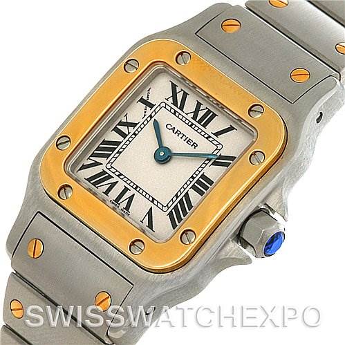 The image shows a close-up of the Cartier Santos W20012C4 Women
s Stainless Steel Silver Dial W20012C4 Women
s Stainless Steel Silver Dial watch face, bezel, and part of the bracelet.