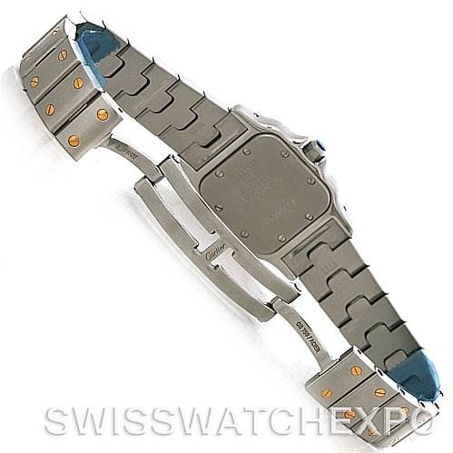 The image shows the back view of a Santos model watch by Cartier, highlighting its bracelet and clasp.