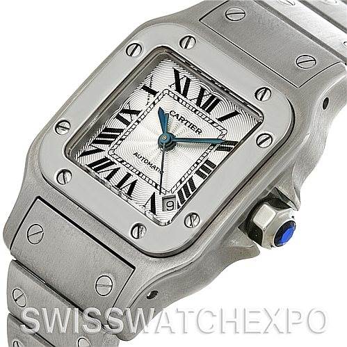 The image shows a close-up, side angle of the Cartier Santos W20054D6 Women
s Stainless Steel Silver Dial W20054D6 Women
s Stainless Steel Silver Dial watch, highlighting the face, bezel, and part of the bracelet.