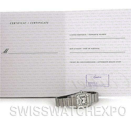 The image shows a Cartier Santos W20054D6 Women
s Stainless Steel Silver Dial W20054D6 Women
s Stainless Steel Silver Dial watch displayed at a slight angle with its certificate of Best Quality
ity in the background.