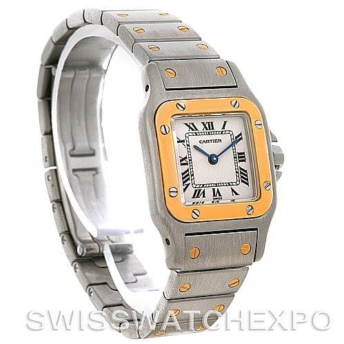 The image shows a Cartier Santos W20012C4 Women
s Stainless Steel Silver Dial W20012C4 Women
s Stainless Steel Silver Dial watch angled from the front-left, highlighting the face, bezel, and metal bracelet with gold accents.