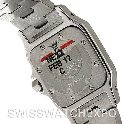 The image shows the back of a Cartier Santos W20056D6 Women
s Stainless Steel Silver Dial W20056D6 Women
s Stainless Steel Silver Dial watch, displaying details such as the case back, screws, and part of the bracelet.