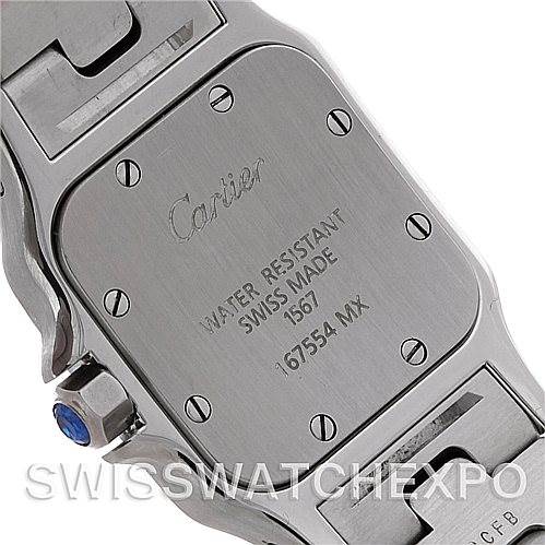 The image shows the back case and bracelet of a Santos model watch by Cartier, displaying engraved details.