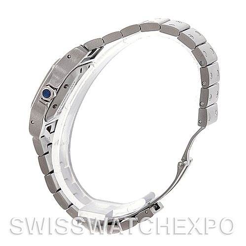 This image shows the side profile of the Cartier Santos W20054D6 Women
s Stainless Steel Silver Dial W20054D6 Women
s Stainless Steel Silver Dial watch, highlighting its bracelet and crown with a blue gemstone.