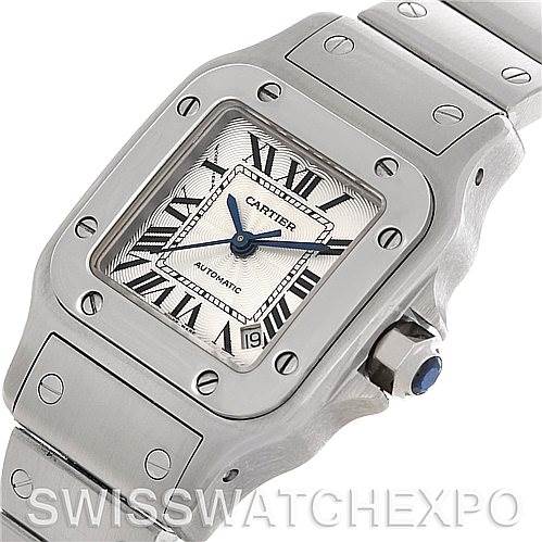 The image shows a Cartier Santos W20054D6 Women
s Stainless Steel Silver Dial W20054D6 Women
s Stainless Steel Silver Dial watch from a slightly tilted top-down angle, highlighting the bezel, dial, crown, and part of the bracelet.