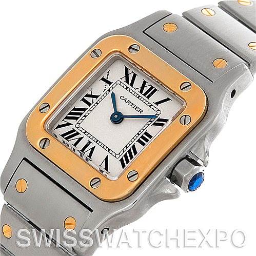 The image shows a close-up angle of a Cartier Santos W20012C4 Women
s Stainless Steel Silver Dial W20012C4 Women
s Stainless Steel Silver Dial watch, highlighting the dial, bezel, screws, and part of the bracelet.