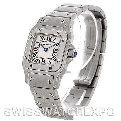 The image shows a Cartier Santos W20056D6 Women
s Stainless Steel Silver Dial W20056D6 Women
s Stainless Steel Silver Dial watch from an angled view, highlighting its square face, stainless steel case, and bracelet.
