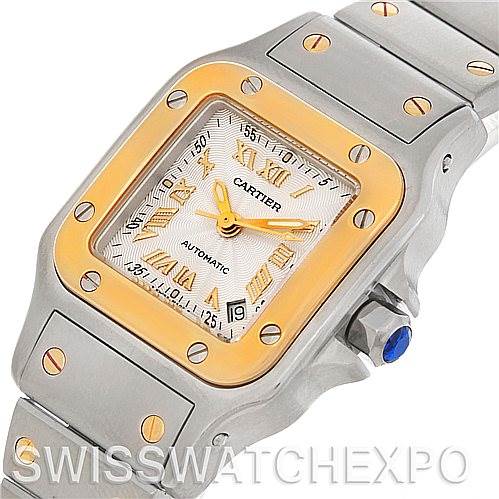 The image shows a Cartier Santos W20057C4 Women's Stainless Steel Silver Dial W20057C4 Women's Stainless Steel Silver Dial watch at a three-quarter angle, highlighting its square face, golden bezel, and bracelet with visible screws.