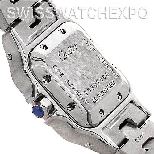 The image shows the back case and part of the bracelet of a Cartier Santos W20057C4 Women's Stainless Steel Silver Dial W20057C4 Women's Stainless Steel Silver Dial watch, focusing on the brand's engraving, serial number, and water resistance details.