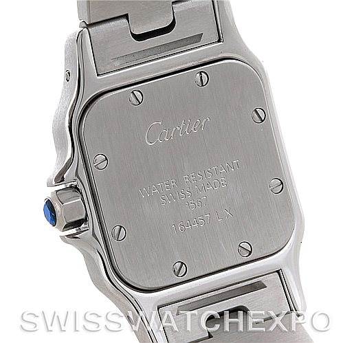 The image shows the case back of the Cartier Santos W20012C4 Women
s Stainless Steel Silver Dial W20012C4 Women
s Stainless Steel Silver Dial watch, highlighting the engravings and metal clasp on the bracelet.