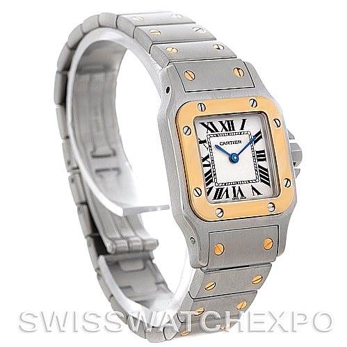 This image shows the Santos model by Cartier at a three-quarter angle, highlighting the face, bezel, crown, and metal bracelet.