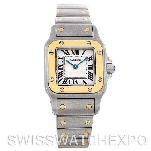 The image shows a frontal view of the Cartier Santos W20012C4 Women
s Stainless Steel Silver Dial W20012C4 Women
s Stainless Steel Silver Dial watch, highlighting its square face, gold screws, and metal bracelet.