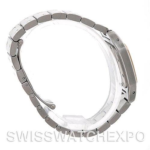 The image shows a side profile of a Cartier Santos W20012C4 Women
s Stainless Steel Silver Dial W20012C4 Women
s Stainless Steel Silver Dial watch, focusing on its stainless steel case and bracelet.