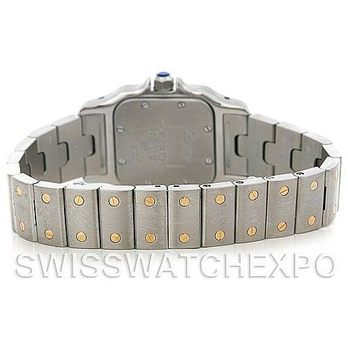 This is a rear view of the Santos model by Cartier, showing the case back and part of the bracelet with gold screw accents.