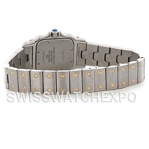 This image shows the backside of a Cartier Santos W20012C4 Women
s Stainless Steel Silver Dial W20012C4 Women
s Stainless Steel Silver Dial watch, highlighting its stainless steel bracelet with gold screws and the back of the case.