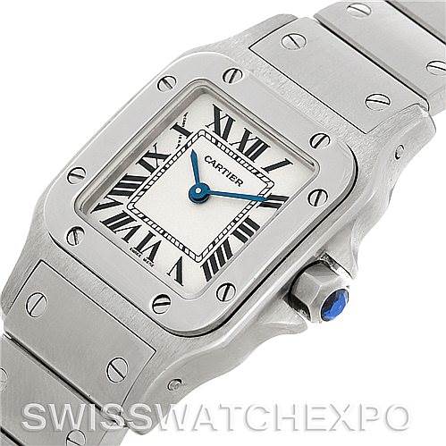 The image shows a close-up of the Cartier Santos W20056D6 Women
s Stainless Steel Silver Dial W20056D6 Women
s Stainless Steel Silver Dial watch, featuring its rectangular dial, bezel with screws, and part of the bracelet.