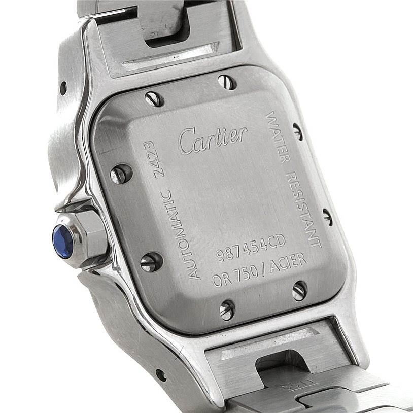 The image shows the back case and partial side view of a Cartier Santos W20045C4 Women
s Stainless Steel Silver Dial W20045C4 Women
s Stainless Steel Silver Dial watch, including its blue cabochon crown.