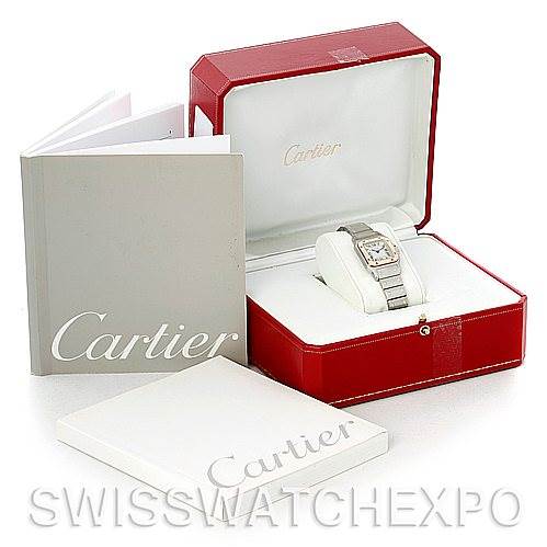 The image shows a Santos model by Cartier from a top angle, including the watch, its red box, and accompanying booklets.
