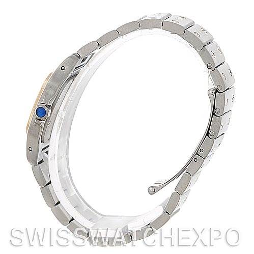 This image shows a side view of the Santos model watch by Cartier, highlighting its metal bracelet and blue cabochon crown.