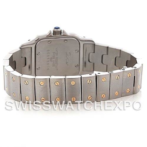The image shows the back view of a Santos model by Cartier, highlighting its stainless steel bracelet with gold screws.