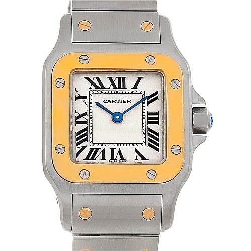 This image shows a close-up front view of the Santos model by Cartier, highlighting the dial, bezel, and part of the bracelet.