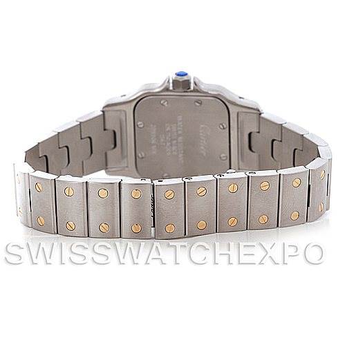 The image shows the back view of a Santos model by Cartier, highlighting the case back and metal bracelet.