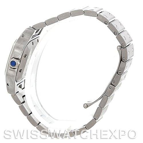 The image shows a side view of a Cartier Santos W20054D6 Women
s Stainless Steel Silver Dial W20054D6 Women
s Stainless Steel Silver Dial watch, focusing on the bracelet and the crown with a blue cabochon.