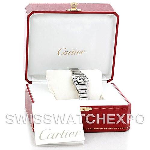 The Cartier Santos W20056D6 Women
s Stainless Steel Silver Dial W20056D6 Women
s Stainless Steel Silver Dial watch is displayed in an open red case, with an instruction booklet beside it.