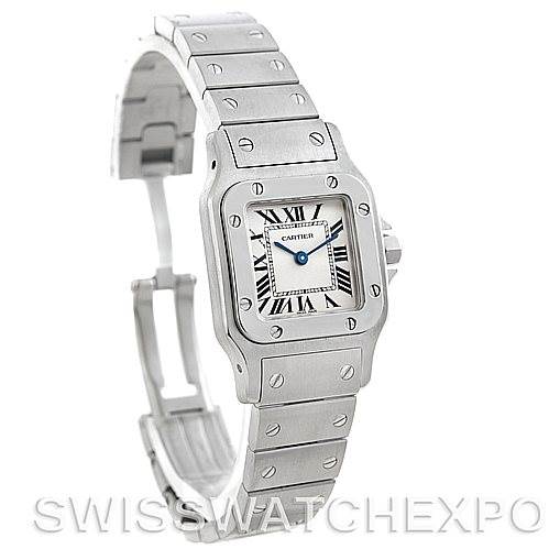 The image shows a side angle of a Cartier Santos W20056D6 Women
s Stainless Steel Silver Dial W20056D6 Women
s Stainless Steel Silver Dial watch, highlighting the watch face, bezel, and partially open bracelet.