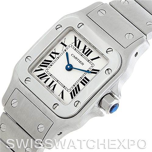 This image shows the Cartier Santos W20056D6 Women
s Stainless Steel Silver Dial W20056D6 Women
s Stainless Steel Silver Dial watch at an angled close-up, highlighting the face, bezel, and part of the metal bracelet with screws.