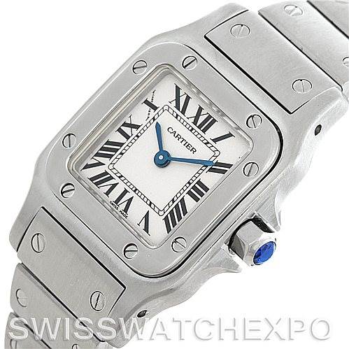 The image shows a close-up of the Cartier Santos W20056D6 Women
s Stainless Steel Silver Dial W20056D6 Women
s Stainless Steel Silver Dial watch featuring the face, bezel, and part of the bracelet.