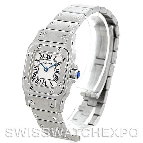 The image shows a Cartier Santos W20056D6 Women
s Stainless Steel Silver Dial W20056D6 Women
s Stainless Steel Silver Dial watch from a three-quarter angle, highlighting its face, bezel, crown, and metal bracelet.