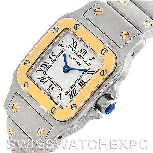 This image shows a close-up view of the Cartier Santos W20012C4 Women
s Stainless Steel Silver Dial W20012C4 Women
s Stainless Steel Silver Dial watch, highlighting its dial, bezel, bracelet, and crown.