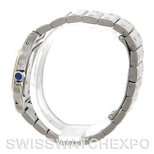 The image shows a side view of the Cartier Santos W20012C4 Women
s Stainless Steel Silver Dial W20012C4 Women
s Stainless Steel Silver Dial watch, focusing on the bracelet and the crown with a blue gemstone.