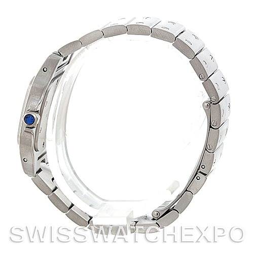 This image shows a side view of a Cartier Santos W20056D6 Women
s Stainless Steel Silver Dial W20056D6 Women
s Stainless Steel Silver Dial model watch, highlighting the bracelet and crown with a blue cabochon.