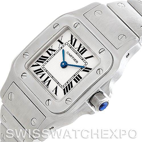 The image shows a close-up angled view of the Cartier Santos W20056D6 Women
s Stainless Steel Silver Dial W20056D6 Women
s Stainless Steel Silver Dial watch, highlighting its face, bezel, and part of its bracelet.