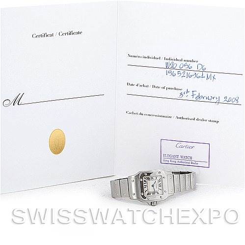The image shows the Cartier Santos W20056D6 Women
s Stainless Steel Silver Dial W20056D6 Women
s Stainless Steel Silver Dial watch laid flat beside its open certificate.