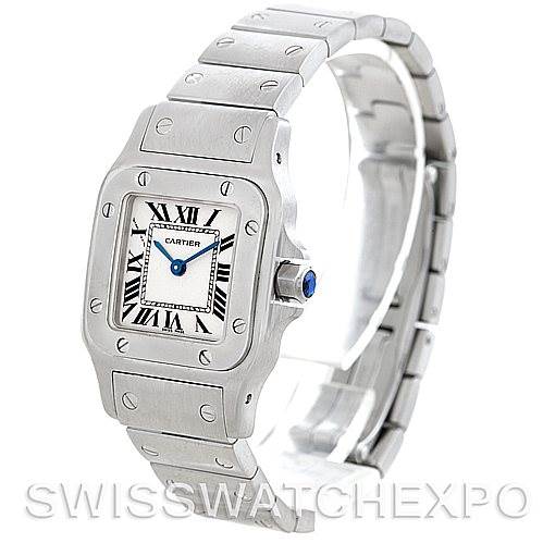 The image shows a Cartier Santos W20056D6 Women
s Stainless Steel Silver Dial W20056D6 Women
s Stainless Steel Silver Dial watch at an angled side view, displaying its face, clasp, and part of the bracelet.