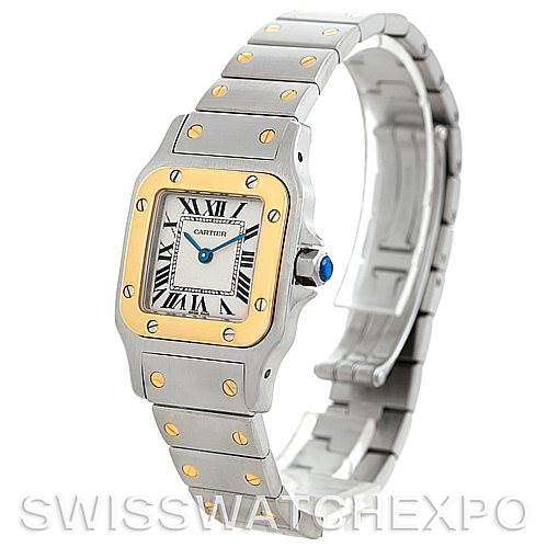 The image shows a Cartier Santos W20012C4 Women's Stainless Steel Silver Dial W20012C4 Women's Stainless Steel Silver Dial watch from a three-quarter angle, highlighting the face, bezel, bracelet, and clasp.